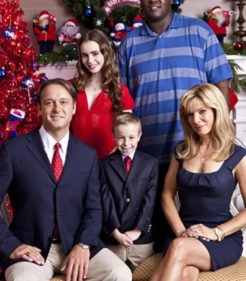Sandra Bullock, Tim McGraw, Jae Head, Quinton Aaron, and Lily Collins in The Blind Side